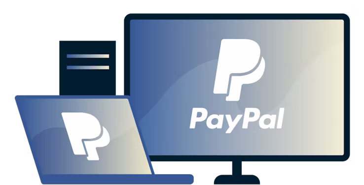 Komputer stacjonarny i laptop z logo PayPal.