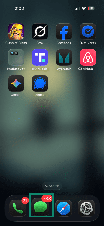 iPhone home screen showing a large unread message count badge on the Messages app icon.