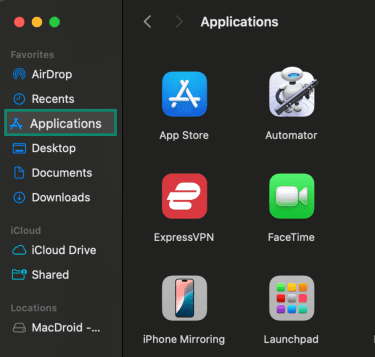 Finder window open on a Mac with Applications selected in the sidebar.